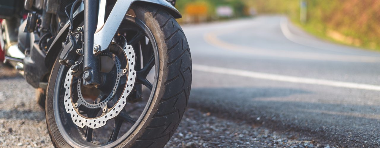 Closeup Of A Motorcycle On The Side Of The Road Needing Towing Help