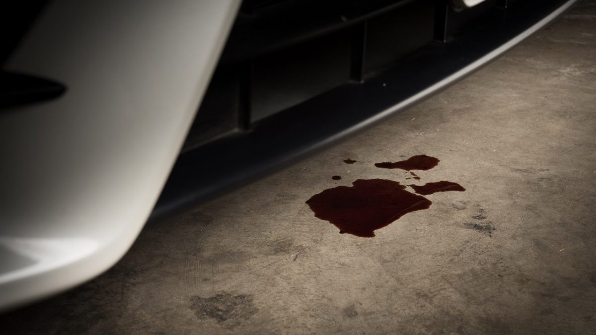 Old oil is leaking from a car