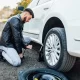 man with a tire emergency