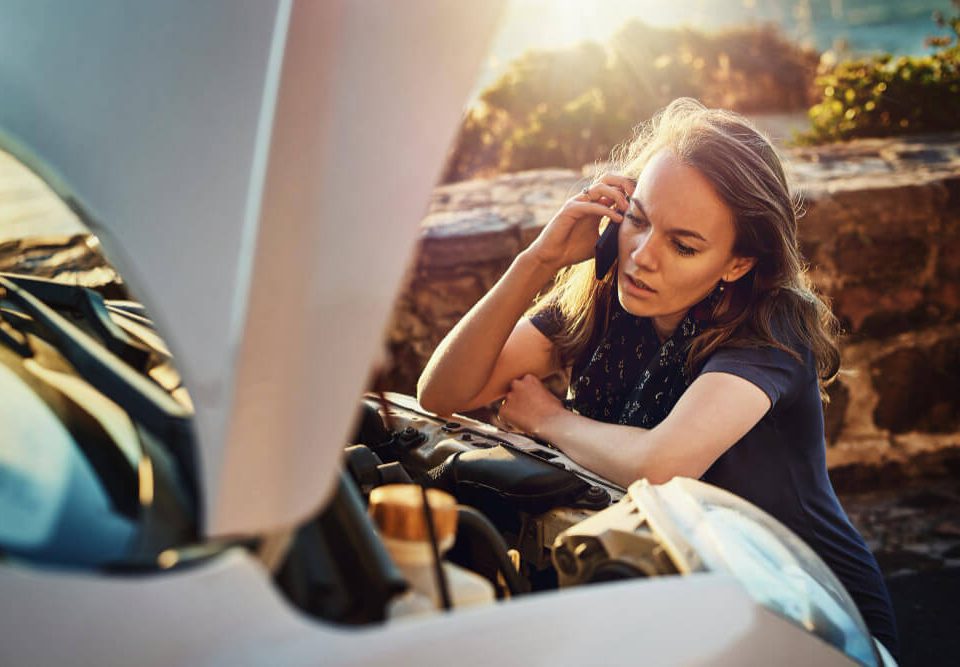woman calling for help during a Sunday car breakdown