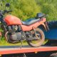unsecured motorcycle on a tow truck