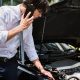 man calling for help because his car transmission is dead